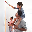 A family paints together for the new baby on the way