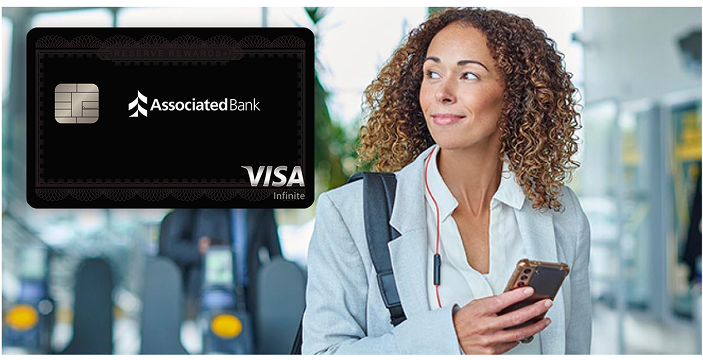 A business woman looks at the superimposed Associated Bank Private Banking Elite credit card