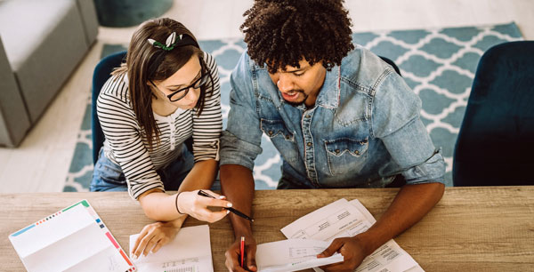 A couple looks over documents together