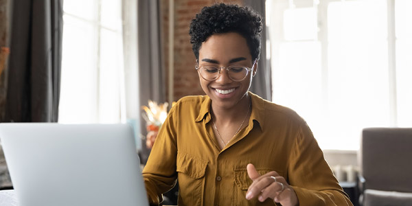 Woman planning her wealth management goals on her laptop