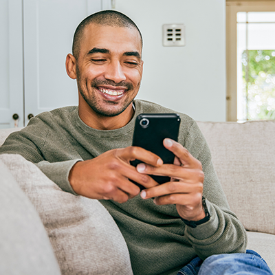 Man smiling at phone