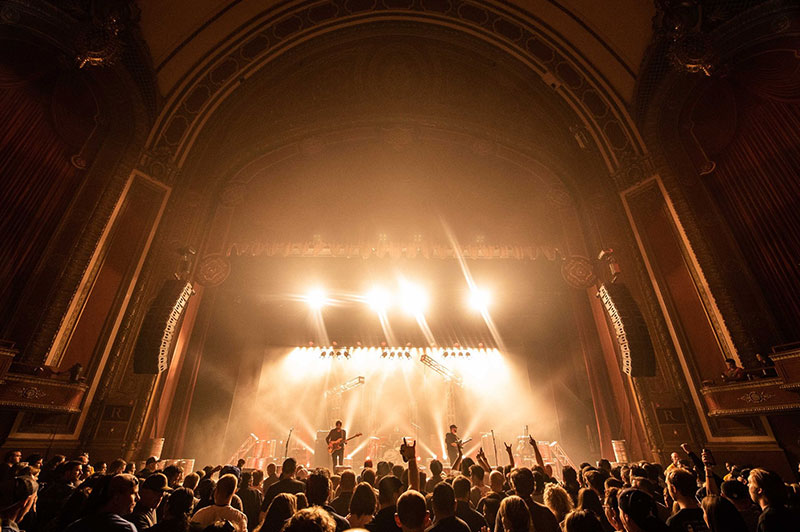 A band performs to a crowd at a Pabst Theater group venue