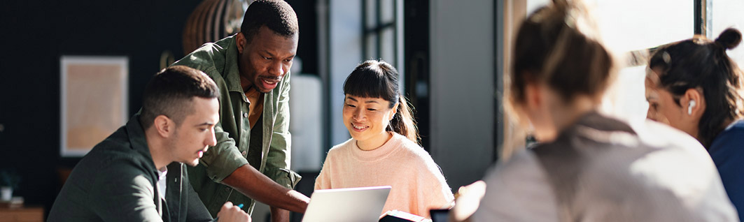 Diverse Team Working Together in Modern Co-Working Space